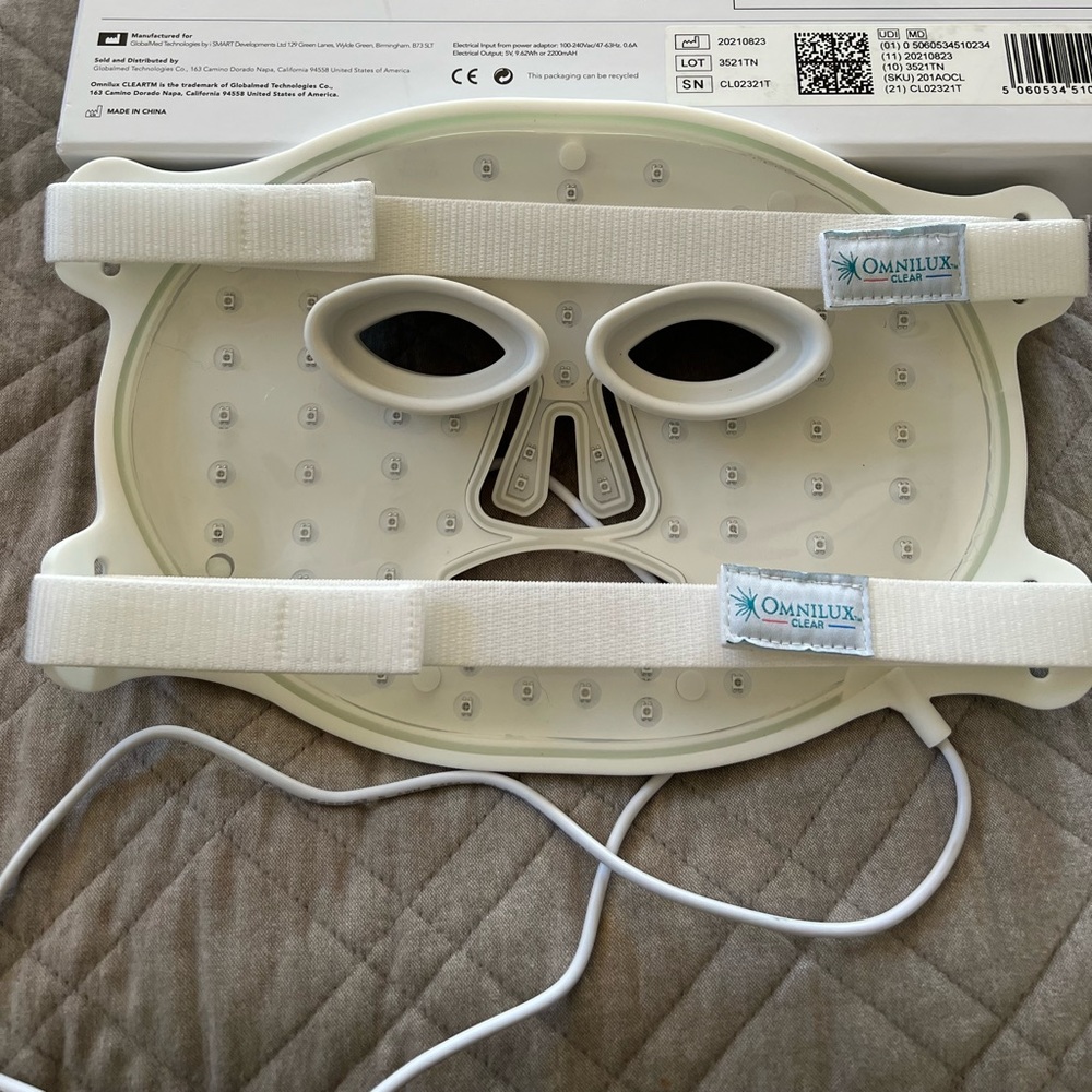 Omnilux clear LED phototherapy mask. ACNE